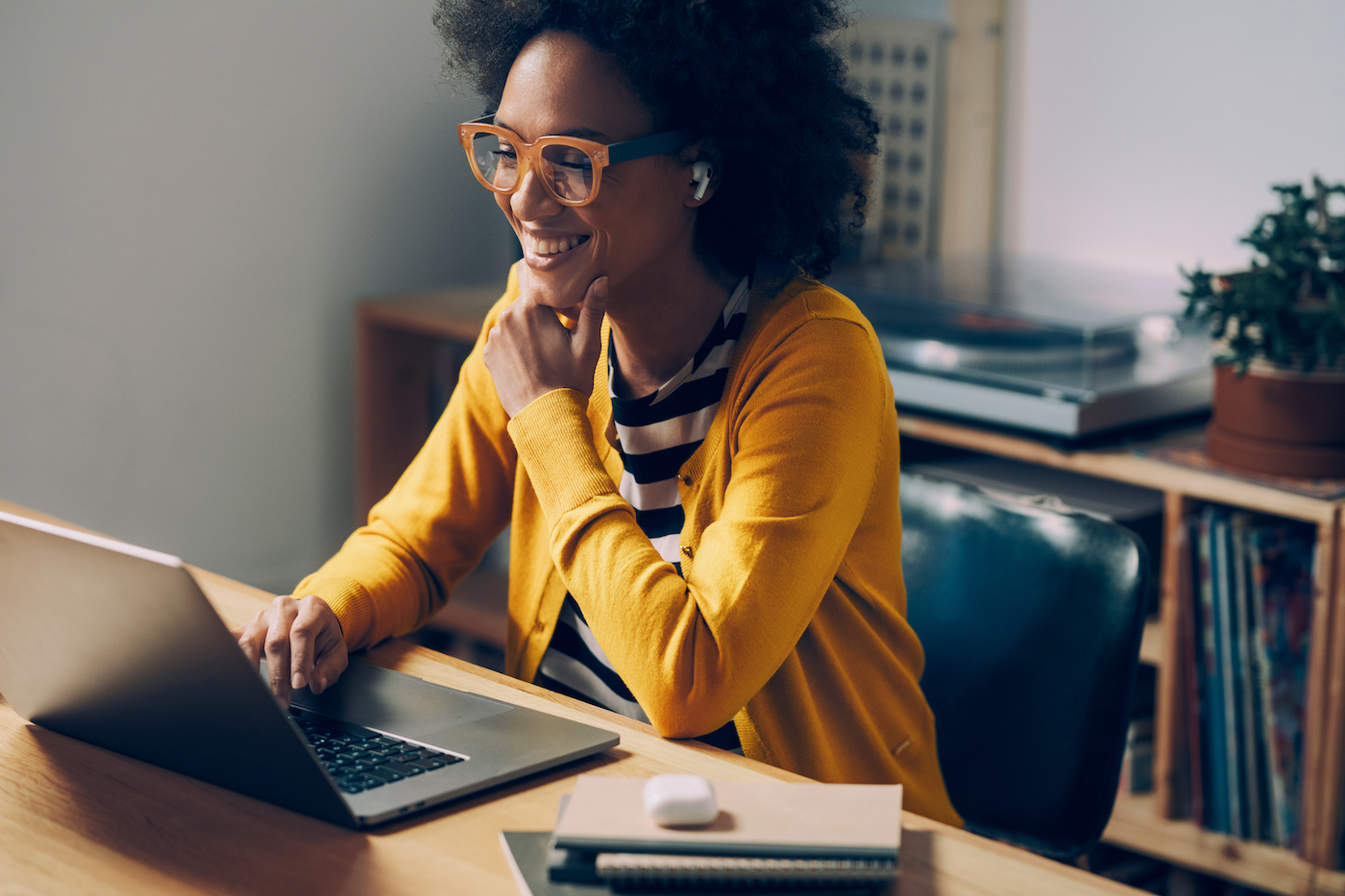 Woman working remotely on a laptop getting technical help from an IT help desk or service desk