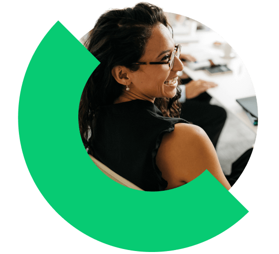 A manager smiling during a meeting.