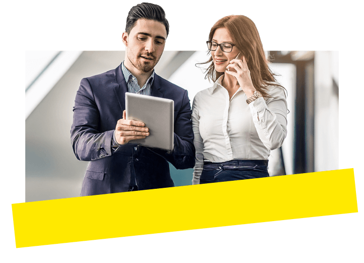 Two lawyers streamline case discussions using a tablet and insights from GoTo Connect to enhance productivity.